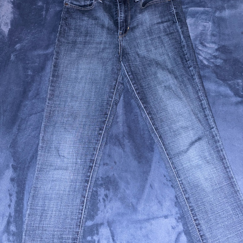 Levi's Women's Straight Leg high rise skinny Jeans in Dark Blue.